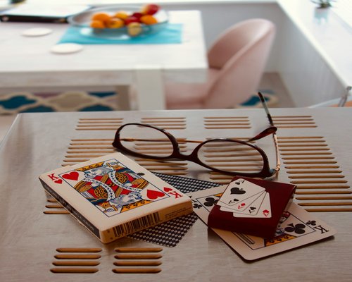 Book and glasses on table, representing education